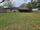 Expansive backyard featuring a screened-in porch and a privacy fence, perfect for outdoor living at 2016 Amesbury Dr, Auburndale, FL 33823