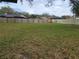 Large, well-maintained backyard with a lush lawn and privacy fences, ideal for recreation and relaxation at 2016 Amesbury Dr, Auburndale, FL 33823