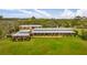 An aerial view of the home and surrounding lush green acreage at 2300 N Scenic Hwy # 120, Lake Wales, FL 33898
