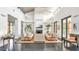 Spacious living room with a fireplace, high ceilings, and modern design at 2300 N Scenic Hwy # 120, Lake Wales, FL 33898