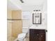 Updated bathroom with tiled shower and dark wood vanity at 2434 Mill Run Blvd, Kissimmee, FL 34744