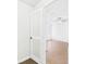 Light and airy bedroom with wood-look flooring, ceiling fan, and white trim at 2434 Mill Run Blvd, Kissimmee, FL 34744