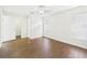 Well-lit bedroom with wood-look floors and an en suite bathroom and closet at 2434 Mill Run Blvd, Kissimmee, FL 34744