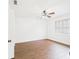 Bedroom featuring wood-look flooring, ceiling fan, and a window at 2434 Mill Run Blvd, Kissimmee, FL 34744