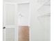 Bedroom view through the closet showing wood-look flooring and ceiling fan at 2434 Mill Run Blvd, Kissimmee, FL 34744