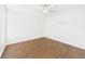Bedroom with hardwood floors and a ceiling fan offering ample natural light at 2434 Mill Run Blvd, Kissimmee, FL 34744