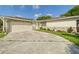 Charming single-story home with a two-car garage and walkway at 2434 Mill Run Blvd, Kissimmee, FL 34744