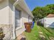 Side view of a house, showing the windows and outdoor storage at 2434 Mill Run Blvd, Kissimmee, FL 34744