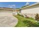 Charming single-story home featuring a two-car garage and birdbath at 2434 Mill Run Blvd, Kissimmee, FL 34744