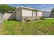 Single-story home featuring stone veneer and landscaped yard at 2434 Mill Run Blvd, Kissimmee, FL 34744
