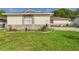 Charming single-story home with stone accents and landscaped front yard at 2434 Mill Run Blvd, Kissimmee, FL 34744