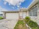 Home with stone accents, attached garage, and inviting front entrance enhancing the property's curb appeal at 2434 Mill Run Blvd, Kissimmee, FL 34744
