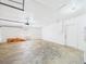 A spacious garage with painted brick walls and a white door at 2434 Mill Run Blvd, Kissimmee, FL 34744