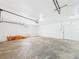 Spacious garage with painted brick wall at 2434 Mill Run Blvd, Kissimmee, FL 34744