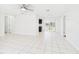 Bright and airy living room with tile flooring, recessed lighting, and sliding glass doors at 2434 Mill Run Blvd, Kissimmee, FL 34744
