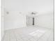 Spacious living room with tile flooring, a ceiling fan, and neutral paint at 2434 Mill Run Blvd, Kissimmee, FL 34744