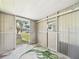 Enclosed porch featuring durable paneling and an easy transition to the outdoors for convenient access at 2434 Mill Run Blvd, Kissimmee, FL 34744