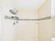Bathroom tile shower with two shower heads and built-in shelf at 2434 Mill Run Blvd, Kissimmee, FL 34744