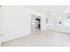 Enclosed sunroom with white tiled floor and sliding glass door leading to the kitchen at 2434 Mill Run Blvd, Kissimmee, FL 34744