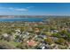 Beautiful aerial view of the house in a lakeside community with mature trees and lush landscaping at 2506 Partridge Dr, Winter Haven, FL 33884