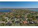 Beautiful aerial view of the house in a lakeside community with mature trees and lush landscaping at 2506 Partridge Dr, Winter Haven, FL 33884