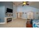 Spacious bedroom featuring a fireplace, TV, walk-in closet and ample natural light at 2506 Partridge Dr, Winter Haven, FL 33884
