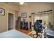 Bedroom featuring a desk, golf memorabilia, and a window with outside views, perfect for a workspace at 2506 Partridge Dr, Winter Haven, FL 33884