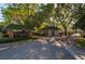 Gated community entrance features brick buildings, manicured landscaping, and secure access for residents at 2506 Partridge Dr, Winter Haven, FL 33884