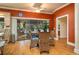 Dining area with backyard pool view, tile floors, and wicker chairs at 2506 Partridge Dr, Winter Haven, FL 33884