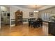 Well-lit dining room featuring a dark wood table, traditional decor, and a view into the living room at 2506 Partridge Dr, Winter Haven, FL 33884