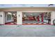 Spacious garage with checkered flooring and custom automotive decor perfect for car enthusiasts at 2506 Partridge Dr, Winter Haven, FL 33884