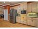 Kitchen featuring stainless steel refrigerator, updated appliances, and spacious cabinetry at 2506 Partridge Dr, Winter Haven, FL 33884