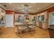 Kitchen with granite counters, stainless appliances, and an island with seating at 2506 Partridge Dr, Winter Haven, FL 33884