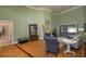 Bright living room with hardwood floors, high ceilings, and large windows showcasing the outdoor space at 2506 Partridge Dr, Winter Haven, FL 33884