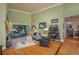 Bright living room featuring hardwood floors, a fireplace, comfortable seating, and pool view at 2506 Partridge Dr, Winter Haven, FL 33884