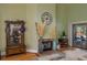 Cozy living room with fireplace, hardwood floors, and sliding glass doors to the outdoor pool area at 2506 Partridge Dr, Winter Haven, FL 33884