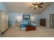 Spacious main bedroom with a ceiling fan, nautical decor, and ample storage at 2506 Partridge Dr, Winter Haven, FL 33884