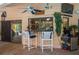 Outdoor bar area with seating and decor overlooking the backyard at 2506 Partridge Dr, Winter Haven, FL 33884