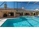 Expansive screened pool area with spa, outdoor kitchen, and ample seating at 2506 Partridge Dr, Winter Haven, FL 33884