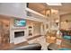 Living room featuring a fireplace, skylights and an upper level loft overlooking the living space at 26 Casarena Ct, Winter Haven, FL 33881