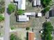 Overhead view of a home with multiple structures on a large lot, highlighting its spacious layout at 2606 Tall Palm Ave, Lake Wales, FL 33898