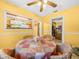 Inviting dining room with wicker chairs, decorative mirror, and view to a full closet at 2606 Tall Palm Ave, Lake Wales, FL 33898