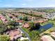 Scenic aerial view of a neighborhood featuring well-maintained homes and multiple serene ponds at 2637 Sunburst Ct, Lake Wales, FL 33898