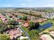 Scenic aerial view of a neighborhood featuring well-maintained homes and multiple serene ponds at 2637 Sunburst Ct, Lake Wales, FL 33898