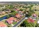 Aerial view of a vibrant community with ponds, lush landscaping, and well-maintained single-story homes at 2637 Sunburst Ct, Lake Wales, FL 33898