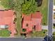 Birds eye view of a single-story house with a red tile roof, manicured landscaping, and street access at 2637 Sunburst Ct, Lake Wales, FL 33898