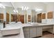 Spacious bathroom featuring dual sinks, ample counter space, and stylish cabinets at 2637 Sunburst Ct, Lake Wales, FL 33898