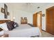 Bright bedroom featuring wood floors, neutral walls, decorative art and a ceiling fan for added comfort at 2637 Sunburst Ct, Lake Wales, FL 33898