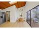 Bright breakfast nook with skylight, wood ceiling, seating for four, and access to a private, enclosed courtyard at 2637 Sunburst Ct, Lake Wales, FL 33898