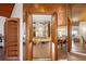 Convenient butler's pantry featuring mirrored accents and access to the dining area at 2637 Sunburst Ct, Lake Wales, FL 33898